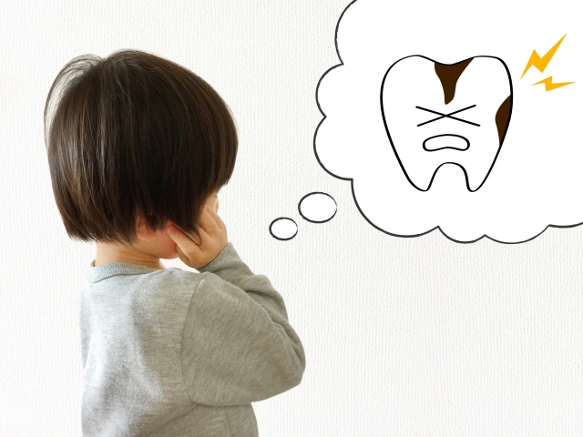 虫歯について考える子供